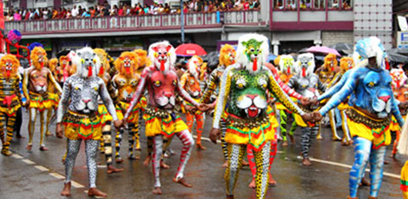 Artists performing Pulikali dance in the streets of Thrissur on the occasion of Onam Festival